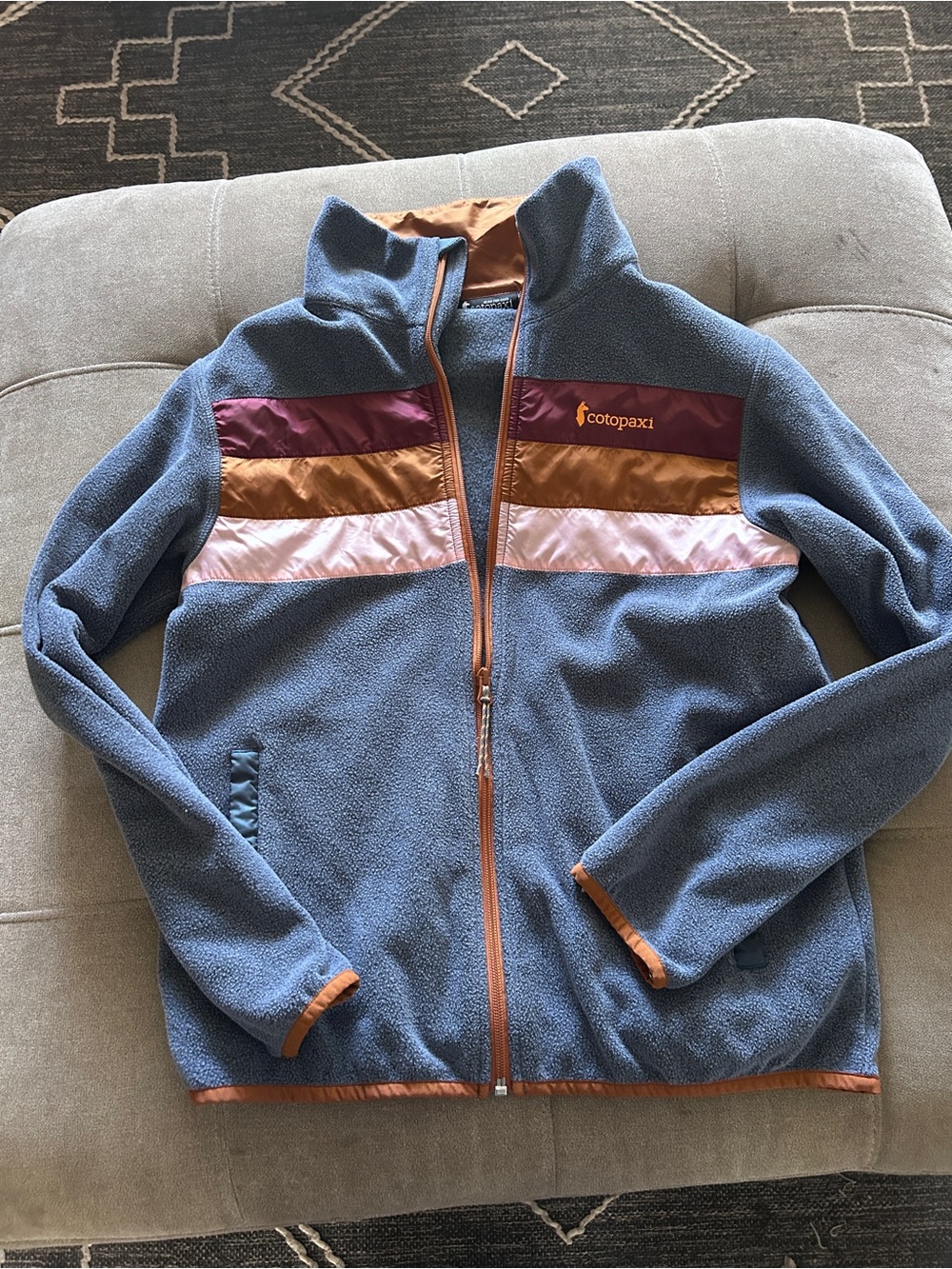 cotopaxi Blue Fleece Jacket with Pink, Gold & Burgundy Stripes